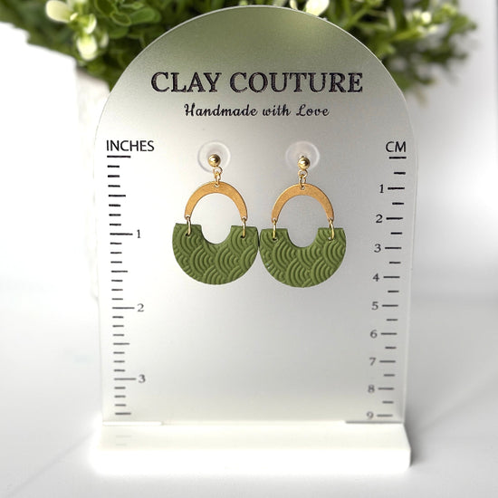 Polymer clay earrings in olive grove color with brass connectors and 18K gold plated studs  on a 'Clay Couture' size stand