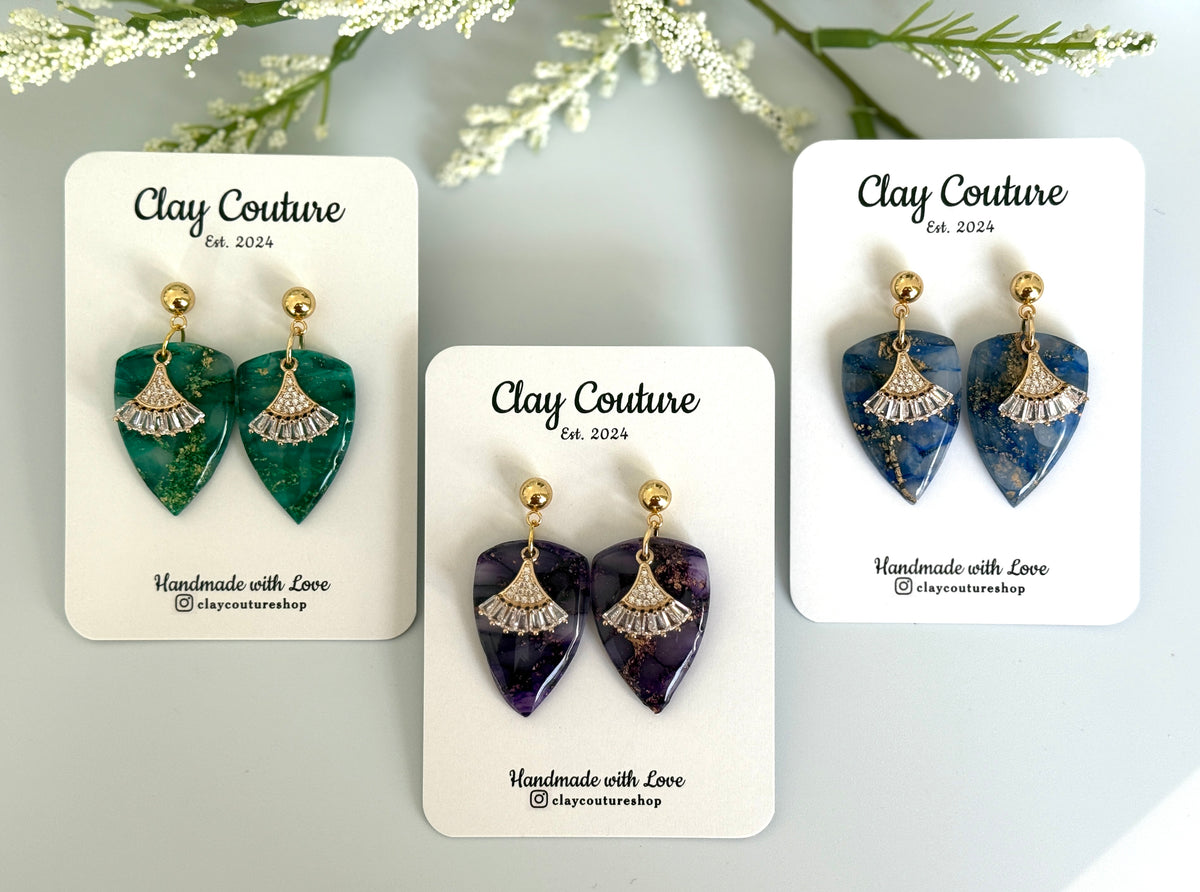 Dagger shaped polymer clay earrings with resin finish and gold studs in three different colors 