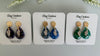 Teardrop shaped polymer clay earrings with resin finish and gold studs in three different colors 